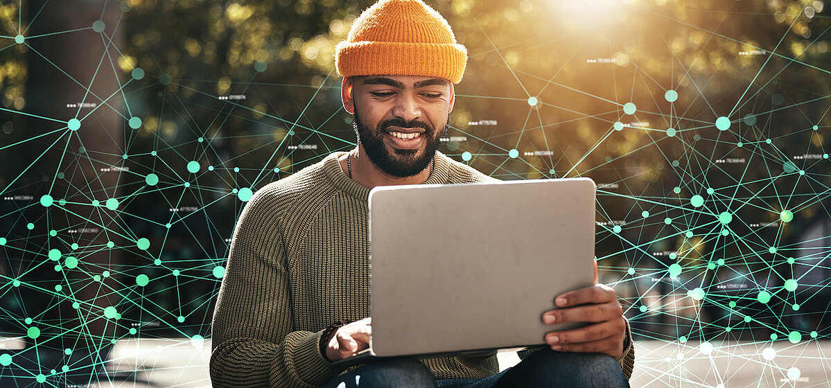 Connected Creativity: Berlin’s contribution to sustainable FinTech solutions Berlin FinTech Professional Develops Sustainable Financial Solutions Outdoors with a Laptop and Connected Graphics